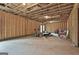 Unfinished basement with exposed beams and plenty of open space, awaiting customization at 130 Brooks Cir, Hampton, GA 30228