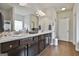 Bathroom featuring double sink vanity with dark wood cabinets and lots of counter space at 130 Brooks Cir, Hampton, GA 30228