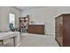 Serene bedroom showcases an ample closet space and a rocking chair, providing a comfortable and organized environment at 130 Brooks Cir, Hampton, GA 30228