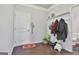 Welcoming entryway features a convenient coat rack and a storage shelf, offering practical organization at 130 Brooks Cir, Hampton, GA 30228