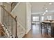 Inviting entryway with staircase leading to a bright, open-concept kitchen and dining area at 130 Brooks Cir, Hampton, GA 30228