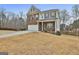 Beautiful two-story home with a brick and siding exterior and attached two car garage at 130 Brooks Cir, Hampton, GA 30228