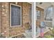 Charming front porch with seating and a decorative American flag at 130 Brooks Cir, Hampton, GA 30228