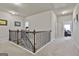 Light-filled hallway with carpeted floors provides seamless access to various rooms, enhancing the home's flow at 130 Brooks Cir, Hampton, GA 30228