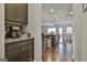 Open-concept kitchen with granite countertops, stainless steel appliances, and hardwood floors at 130 Brooks Cir, Hampton, GA 30228