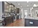 Modern kitchen with stainless steel appliances, granite countertops, and hardwood floors at 130 Brooks Cir, Hampton, GA 30228
