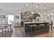 Modern kitchen with granite countertops, stainless steel appliances, and an island with bar seating at 130 Brooks Cir, Hampton, GA 30228
