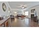 Bright living room showcasing a fireplace, hardwood floors, and multiple seating options at 130 Brooks Cir, Hampton, GA 30228
