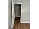 Hallway featuring hardwood floors and gray walls leading to a stairway at 4477 Golf Vista Cir, Decatur, GA 30035