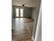 Living room featuring wood floors, french doors, and neutral gray walls at 4477 Golf Vista Cir, Decatur, GA 30035