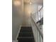 Stairway leading to the second story with light gray walls and painted wood banister at 4477 Golf Vista Cir, Decatur, GA 30035