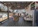 Cozy covered porch with comfortable seating and a charming fire pit at 31 Pecan Lake Ct, Sharpsburg, GA 30277