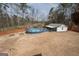 Spacious backyard featuring an above ground swimming pool at 31 Pecan Lake Ct, Sharpsburg, GA 30277