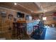 Unique bar area with a custom countertop and seating at 31 Pecan Lake Ct, Sharpsburg, GA 30277