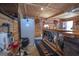 Bar area with a refrigerator, custom bar, and shelving at 31 Pecan Lake Ct, Sharpsburg, GA 30277