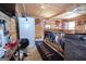 View of a bar area with a refrigerator, custom bar, and shelving at 31 Pecan Lake Ct, Sharpsburg, GA 30277