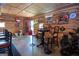 Basement bar area with high chairs, table, and decor, perfect for entertaining friends and Gathering at 31 Pecan Lake Ct, Sharpsburg, GA 30277