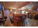 Finished basement featuring a unique bar area with seating, offering a cozy space for social gatherings at 31 Pecan Lake Ct, Sharpsburg, GA 30277