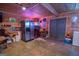 Finished basement with bar area, refrigerator, and ample space for relaxation and entertaining at 31 Pecan Lake Ct, Sharpsburg, GA 30277