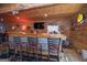 Finished basement featuring bar area with stools, perfect for entertaining with friends and Gathering at 31 Pecan Lake Ct, Sharpsburg, GA 30277
