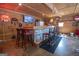 Finished basement featuring a well-equipped bar area with seating, ideal for hosting gatherings and relaxation at 31 Pecan Lake Ct, Sharpsburg, GA 30277