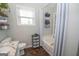 Well-lit bathroom boasting vanity, shower/tub, and storage at 31 Pecan Lake Ct, Sharpsburg, GA 30277