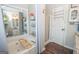 Bathroom with tub, stand up shower, and large mirror at 31 Pecan Lake Ct, Sharpsburg, GA 30277