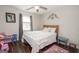 Bedroom with a bed, wood floors, and nice decorations at 31 Pecan Lake Ct, Sharpsburg, GA 30277