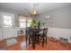 Cozy dining room features natural light and a stylish black table at 31 Pecan Lake Ct, Sharpsburg, GA 30277