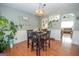 Inviting dining area with hardwood floors and stylish light fixture at 31 Pecan Lake Ct, Sharpsburg, GA 30277
