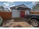 Backyard area with a shed, fencing, and vehicle at 31 Pecan Lake Ct, Sharpsburg, GA 30277