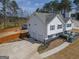Aerial view of a house with a two-car garage and backyard pool at 31 Pecan Lake Ct, Sharpsburg, GA 30277