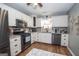 Updated kitchen with white cabinets, granite countertops, and stainless appliances at 31 Pecan Lake Ct, Sharpsburg, GA 30277