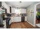 Well-lit kitchen features stainless steel appliances and granite countertops at 31 Pecan Lake Ct, Sharpsburg, GA 30277