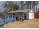 Relaxing outbuilding with a porch, seating and décor for outdoor entertaining at 31 Pecan Lake Ct, Sharpsburg, GA 30277