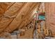 Spacious attic storage area featuring a light, insulation, and shelving at 339 Kensington Dr, Peachtree City, GA 30269