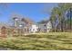 Spacious backyard features a greenhouse and lush green lawn at 339 Kensington Dr, Peachtree City, GA 30269