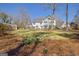 Well maintained yard with a multi-story home and patio, and daffodils at 339 Kensington Dr, Peachtree City, GA 30269