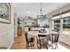 Charming breakfast nook featuring a round table, modern light fixture, and scenic backyard views at 339 Kensington Dr, Peachtree City, GA 30269