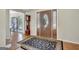 Spacious foyer featuring a patterned rug, hardwood floors, and a decorative front door with glass accents at 339 Kensington Dr, Peachtree City, GA 30269