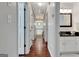 Hallway featuring dark wood floors and access to bathroom and bedroom at 339 Kensington Dr, Peachtree City, GA 30269