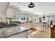 Bright kitchen with granite countertops, stainless steel appliances and wood floors at 339 Kensington Dr, Peachtree City, GA 30269