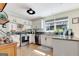 Well-lit kitchen featuring granite countertops, stainless steel appliances, and ample cabinet space at 339 Kensington Dr, Peachtree City, GA 30269