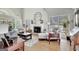 Spacious living room featuring high ceilings, a fireplace, and abundant natural light, creating an inviting atmosphere at 339 Kensington Dr, Peachtree City, GA 30269