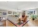 Spacious living room with hardwood floors, large windows, and comfortable seating at 339 Kensington Dr, Peachtree City, GA 30269