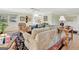 Comfortable living room with hardwood floors, ceiling fan and large windows at 339 Kensington Dr, Peachtree City, GA 30269