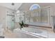 Bright bathroom featuring an integrated soaking tub and glass enclosed shower at 339 Kensington Dr, Peachtree City, GA 30269