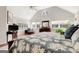 Bright main bedroom featuring a vaulted ceiling, many windows, and hardwood floors at 339 Kensington Dr, Peachtree City, GA 30269