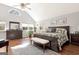 Primary bedroom suite with vaulted ceiling, lots of light, and hardwood flooring at 339 Kensington Dr, Peachtree City, GA 30269