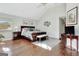 Spacious main bedroom boasts natural light, hardwood floors, and a decorative rug at 339 Kensington Dr, Peachtree City, GA 30269